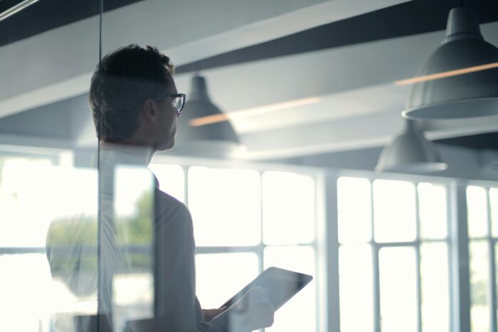 Professional looking out of window