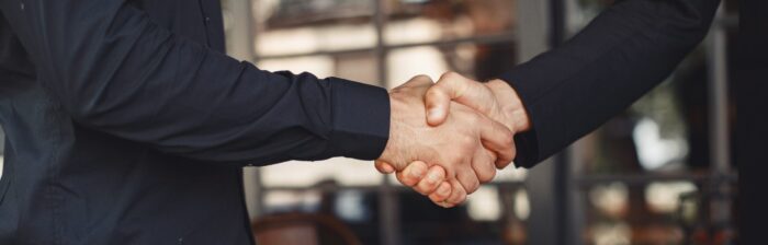 Employees shaking hands