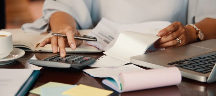 Woman calculating fees