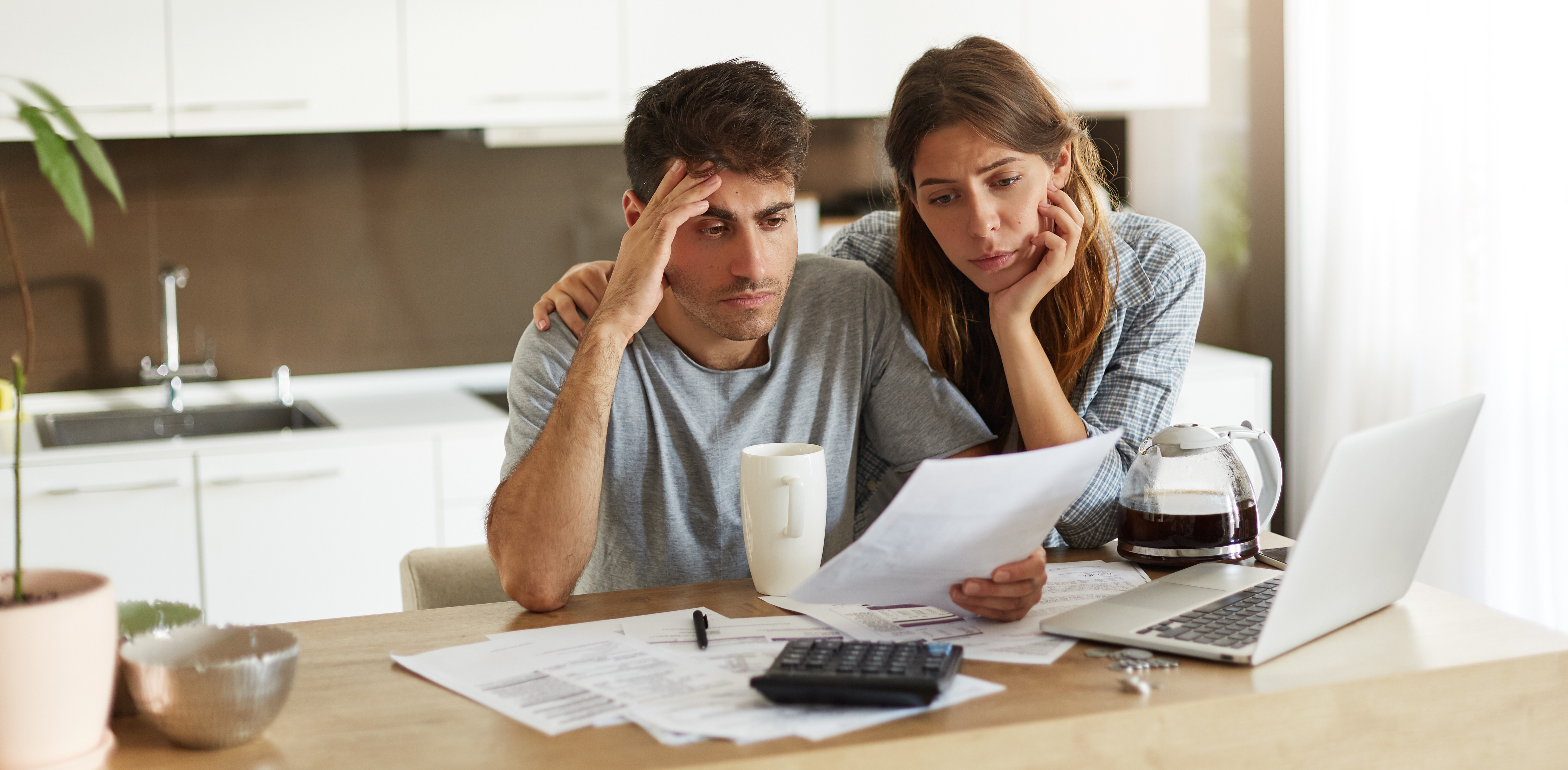 Unhappy couple managing home accounts and insolvency in home
